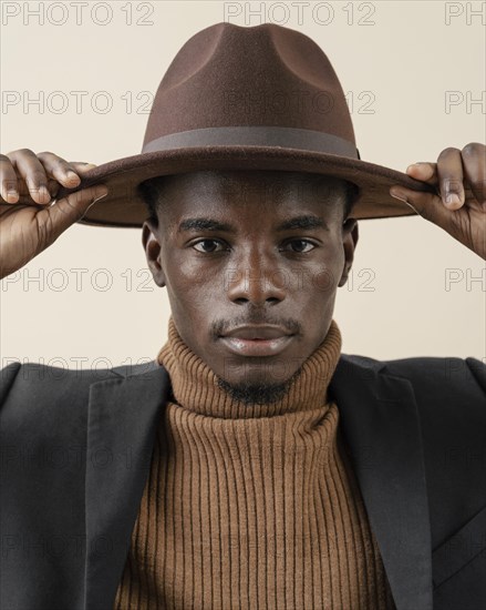 Young handsome man posing with hat 10