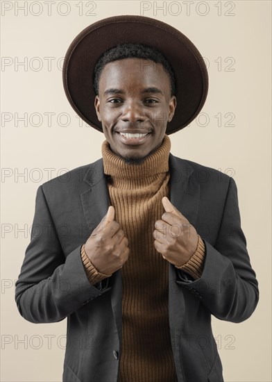 Young handsome man posing with hat 12