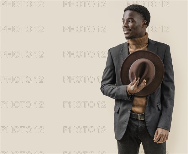 Young handsome man posing with hat 13