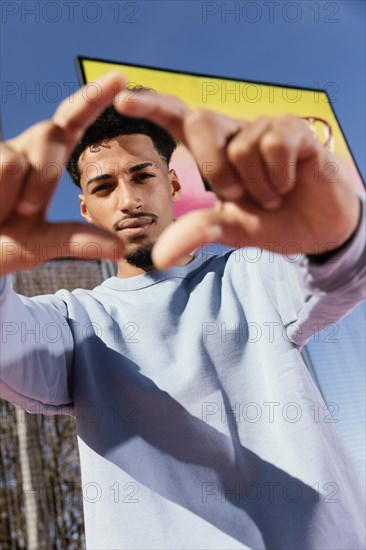 Young man basket field