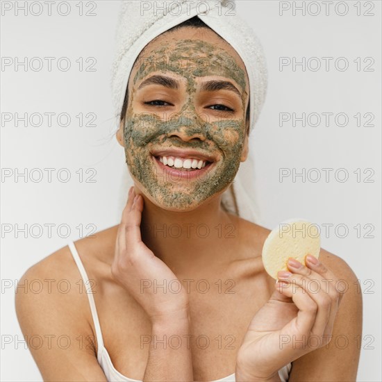Young woman having homemade mask her face