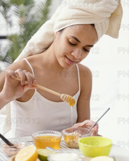 Young woman making natural face mask home