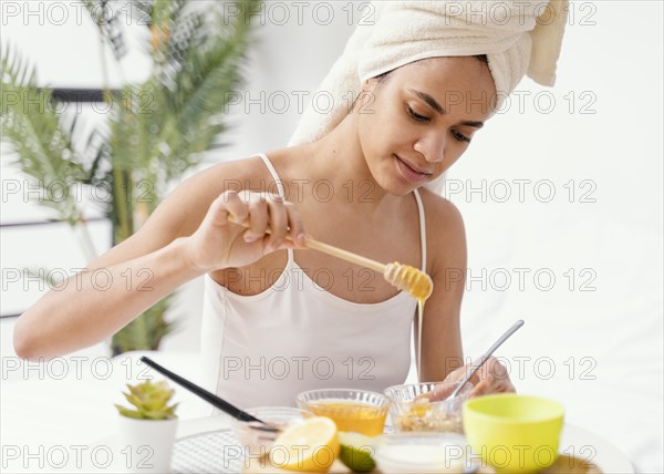 Young woman making natural face mask home 2