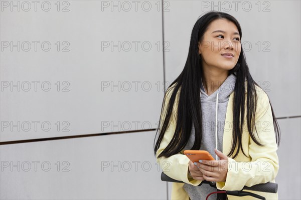 Young woman with mobile outdoor