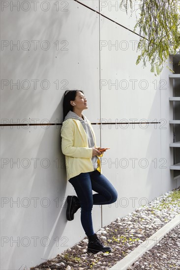 Young woman with mobile outdoor 2