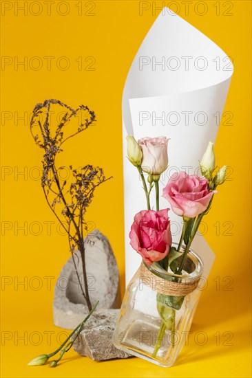 Arrangement with roses vase with paper cone