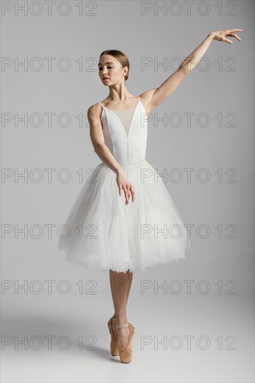 Ballerina standing with pointe shoes