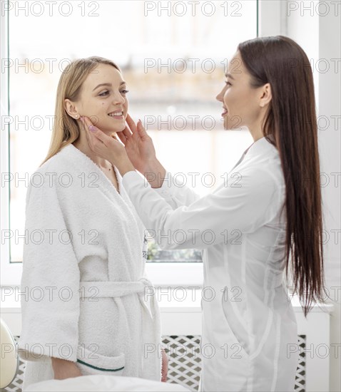 Beautician woman clinic consults client 5