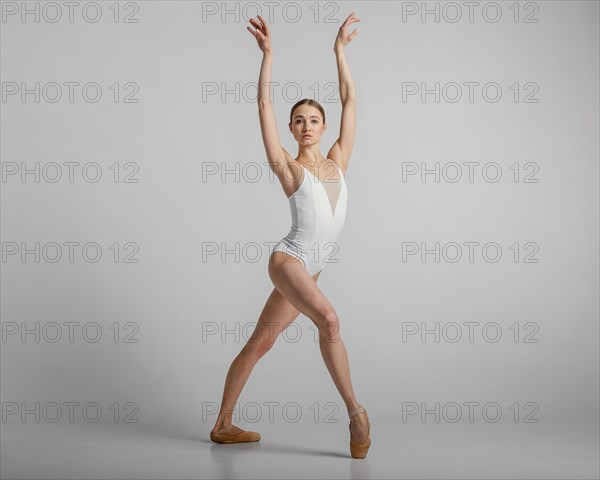 Beautiful ballerina posing full shot
