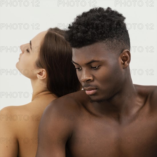 Black man white woman posing close up