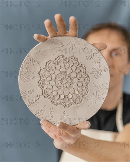 Close up blurry man holding plate