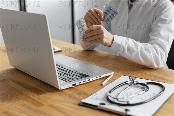 Close up doctor holding pills