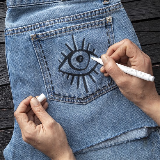 Close up hand drawing jeans