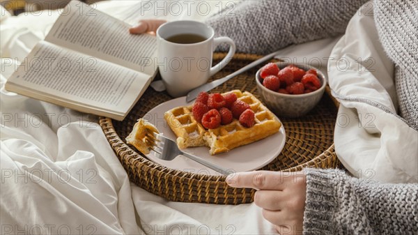 Close up hand holding book fork