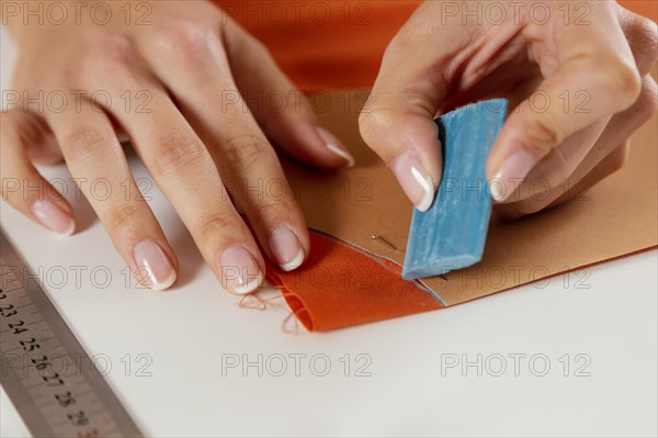 Close up hand marking fabric