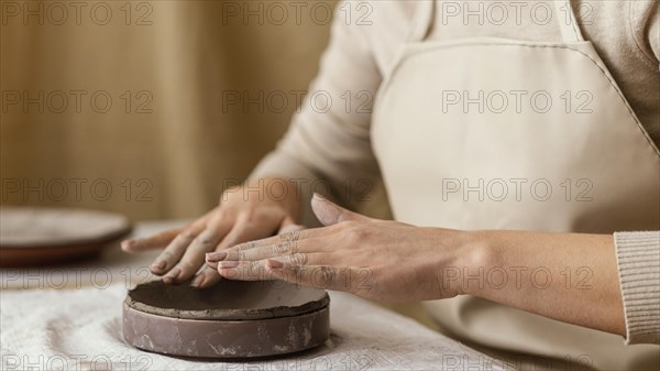 Close up hands doing pottery 2