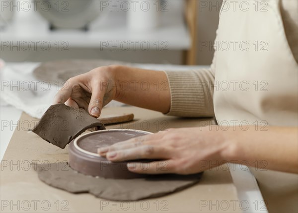 Close up hands doing pottery 3