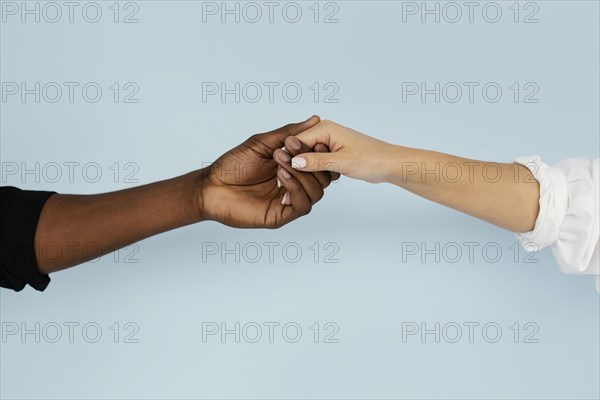 Close up hands holding with blue background