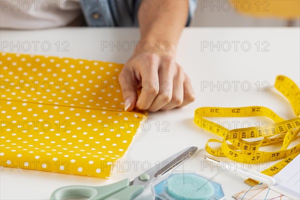 Close up hand touching fabric