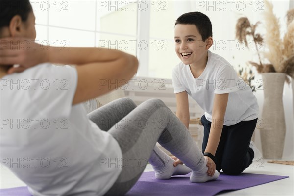 Close up kid woman training together