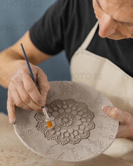 Close up man holding brush