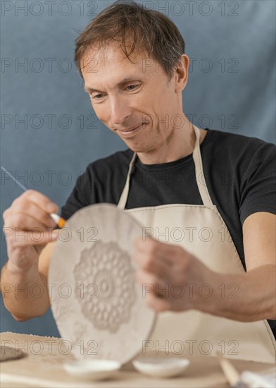 Close up man painting brush