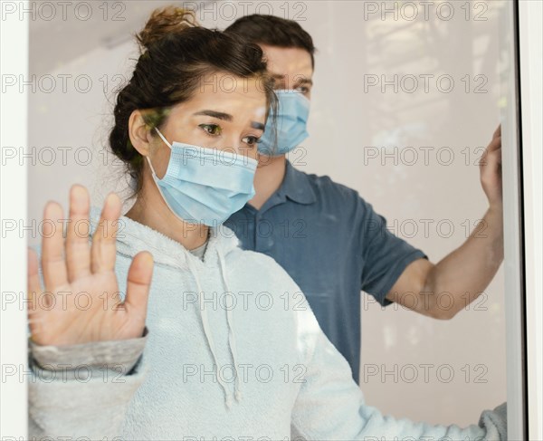 Close up man woman with masks