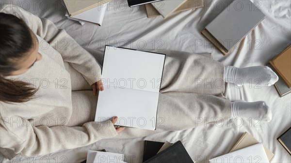 Close up student bed with books flat lay