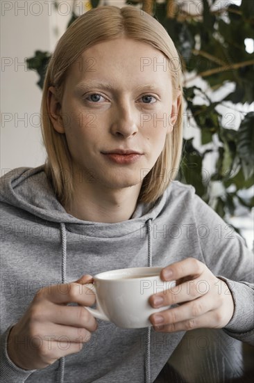 Close up woman holding cup