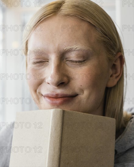Close up woman holding notebook