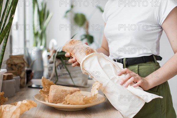 Close up woman holding organic bread