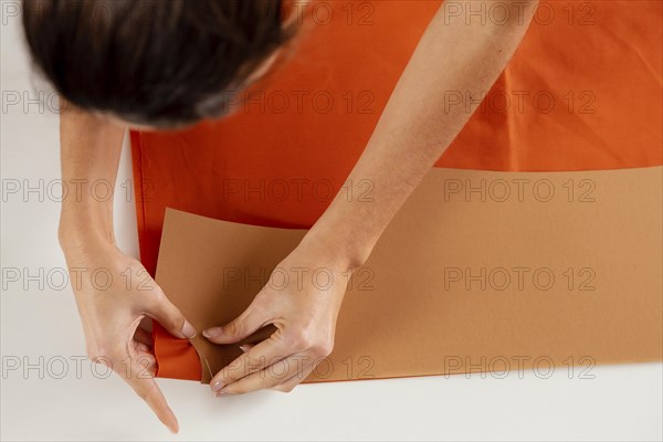 Close up woman making clothing items