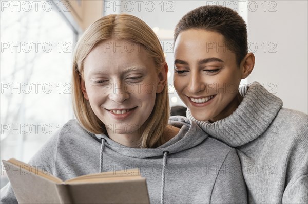 Close up women reading together