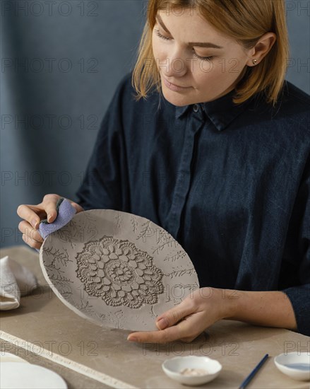 Close up young woman holding plate