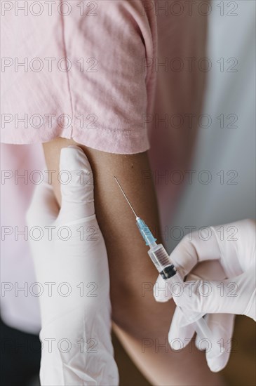 Doctor giving kid vaccine