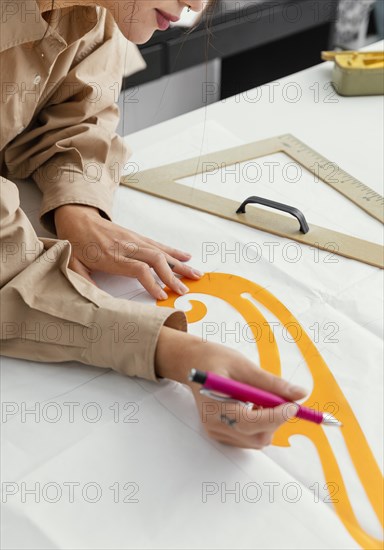 Fashion designer working her workshop alone 4