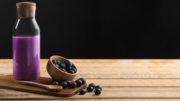 Front view purple smoothie blueberries with copy space