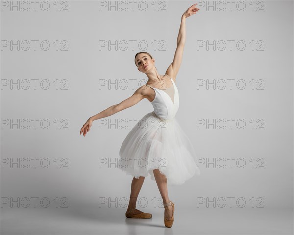 Full shot ballerina wearing beautiful white dress