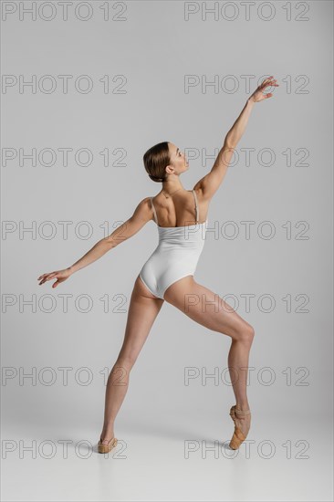 Full shot beautiful ballerina posing