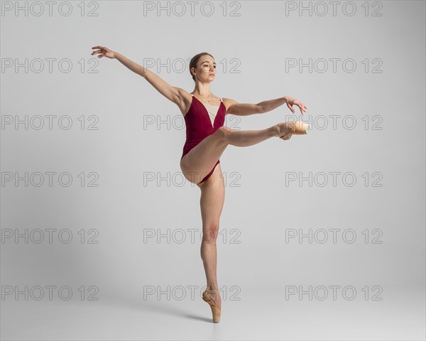 Full shot talented ballerina performing