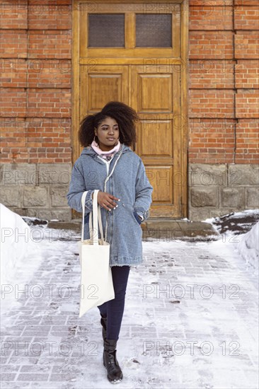 Full shot woman posing with snow