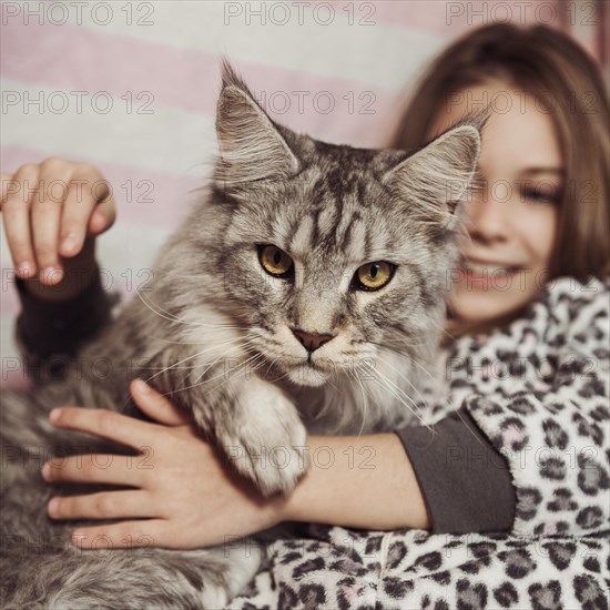 Girl cat sitting bed