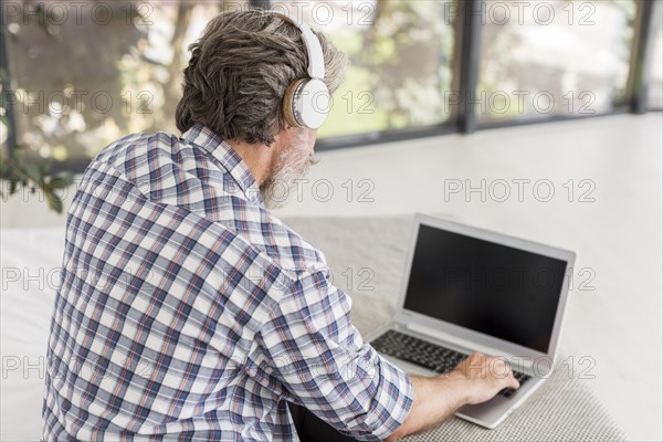 High angle teacher using laptop