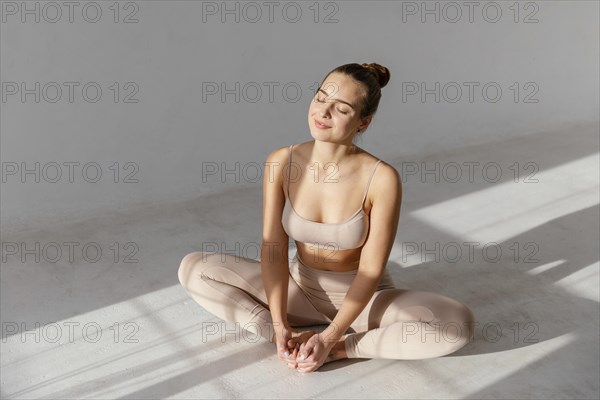 High angle woman sitting floor