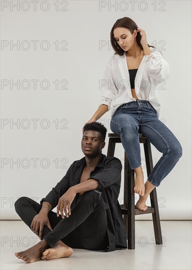 Interracial couple posing full shot