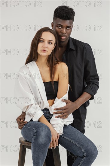 Interracial couple posing medium shot