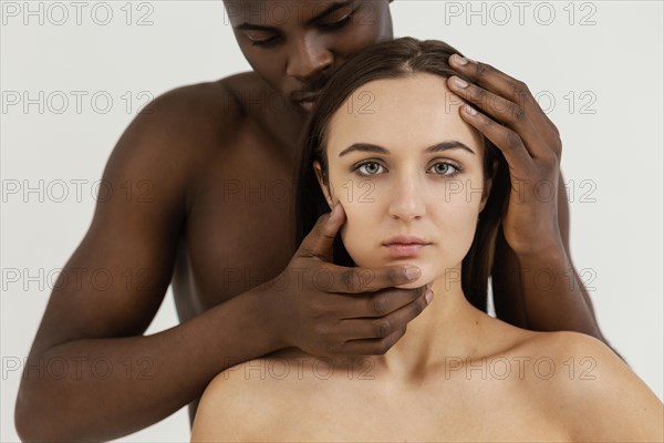 Interracial people posing close up