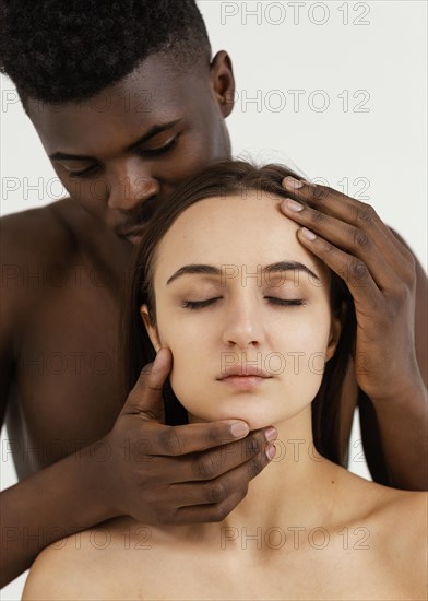 Interracial people posing together