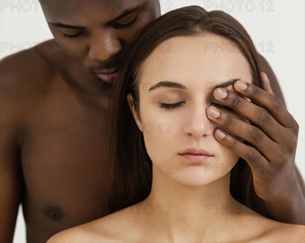 Interracial people with closed eyes