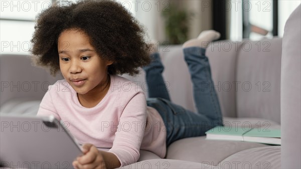 Little girl using tablet